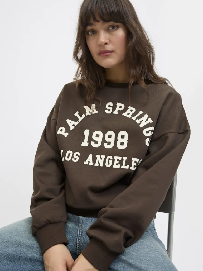 JXMERLE RLX SHORT LS CREW SWT LN bracken